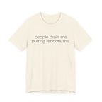 A natural short-sleeve crewneck t-shirt featuring a graphic with 
minimalist lowercase text reading “people drain me. purring reboots me.” for an introvert cat T-shirt