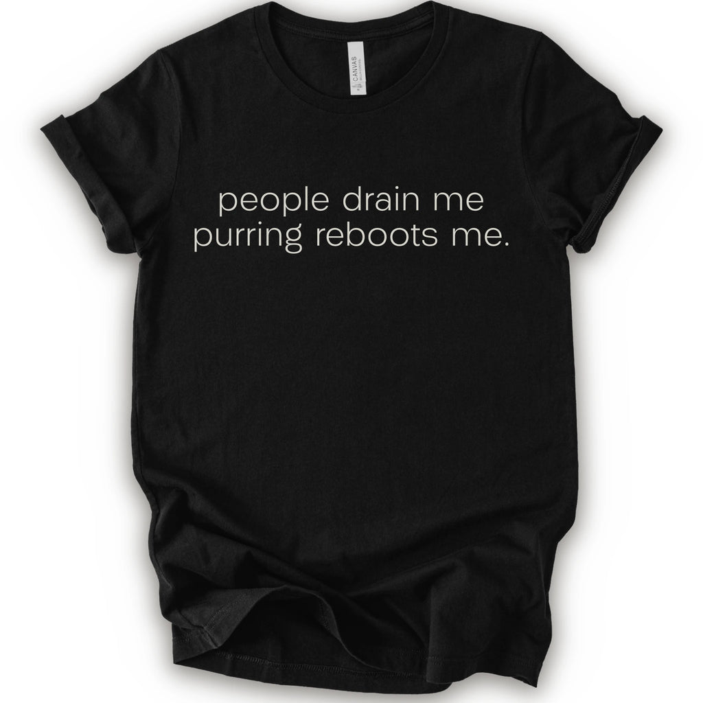 Black graphic t-shirt with minimalist lowercase text reading “people drain me. purring reboots me.” for an introvert cat T-shirt