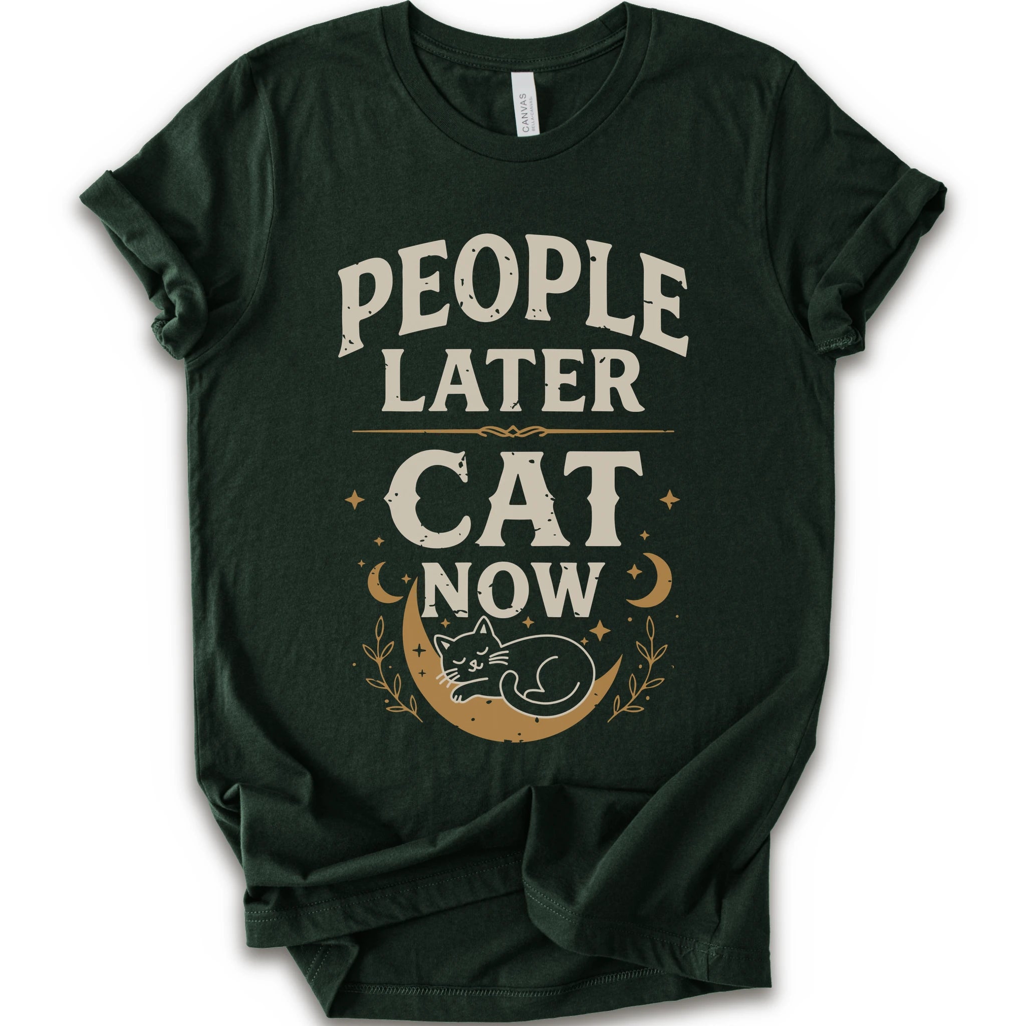 A forest short-sleeve crewneck t-shirt with a distressed graphic print that reads 'PEOPLE LATER CAT NOW' in cream and tan lettering, featuring a sleeping cat on a crescent moon with stars and leaves.