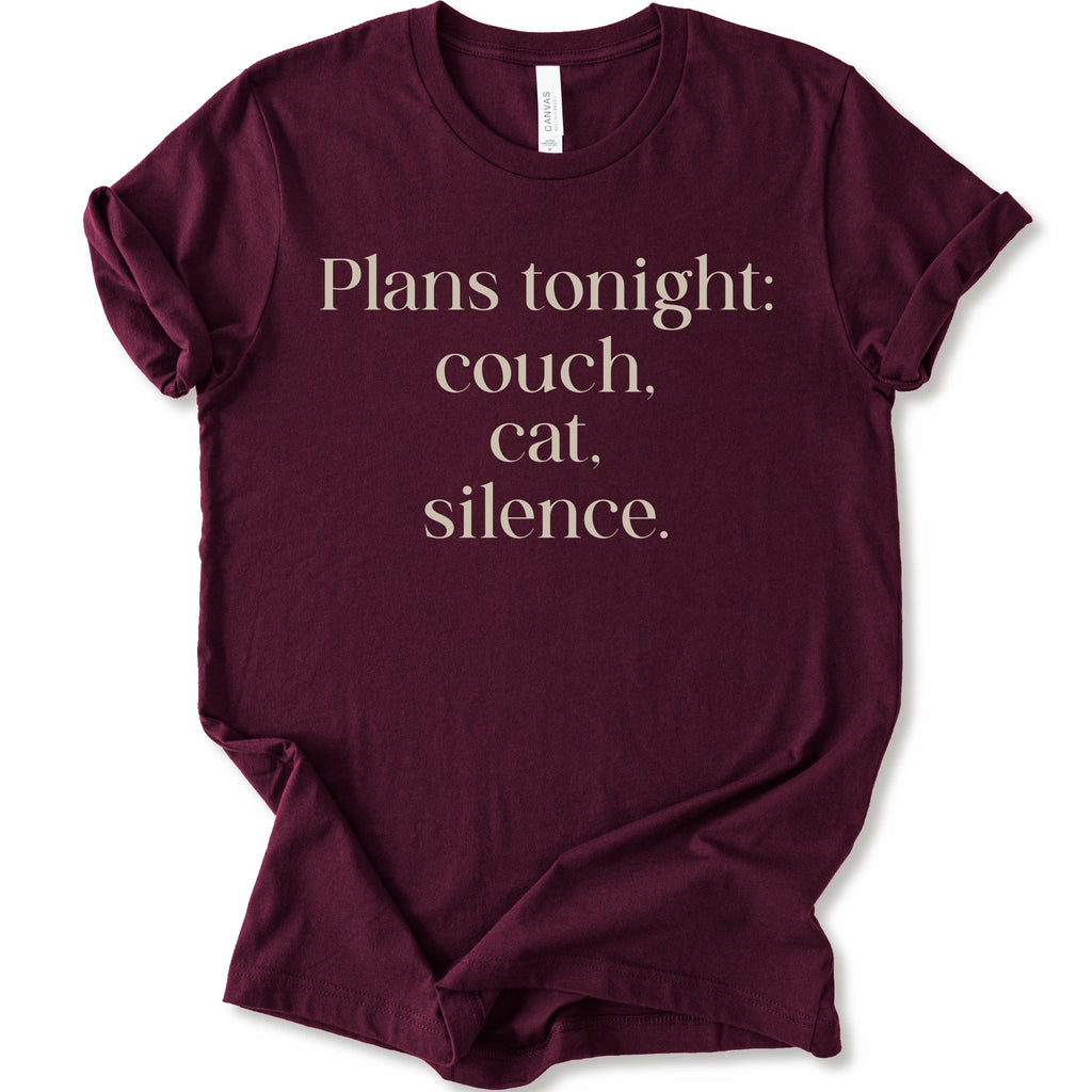 Maroon graphic t-shirt with text "plans tonight: couch, cat, silence" 