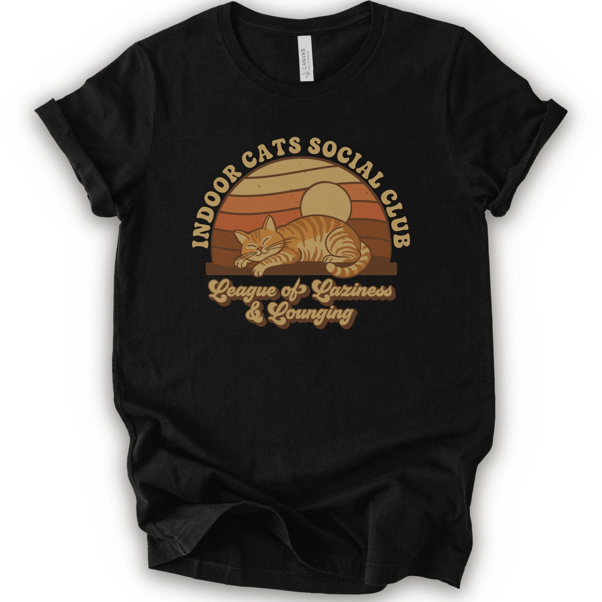 A black short-sleeve crewneck t-shirt featuring a retro-style graphic of an orange tabby cat sleeping under a sunset, with the text 'INDOOR CATS SOCIAL CLUB' and 'League of Laziness & Lounging'.