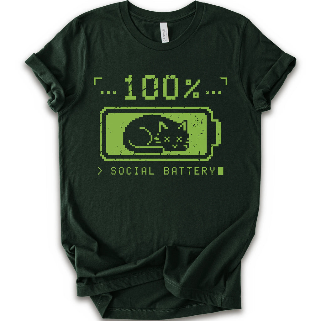 A forest t-shirt with a green pixel-art graphic of a sleeping cat inside a battery icon, with the text '100% SOCIAL BATTERY'.
