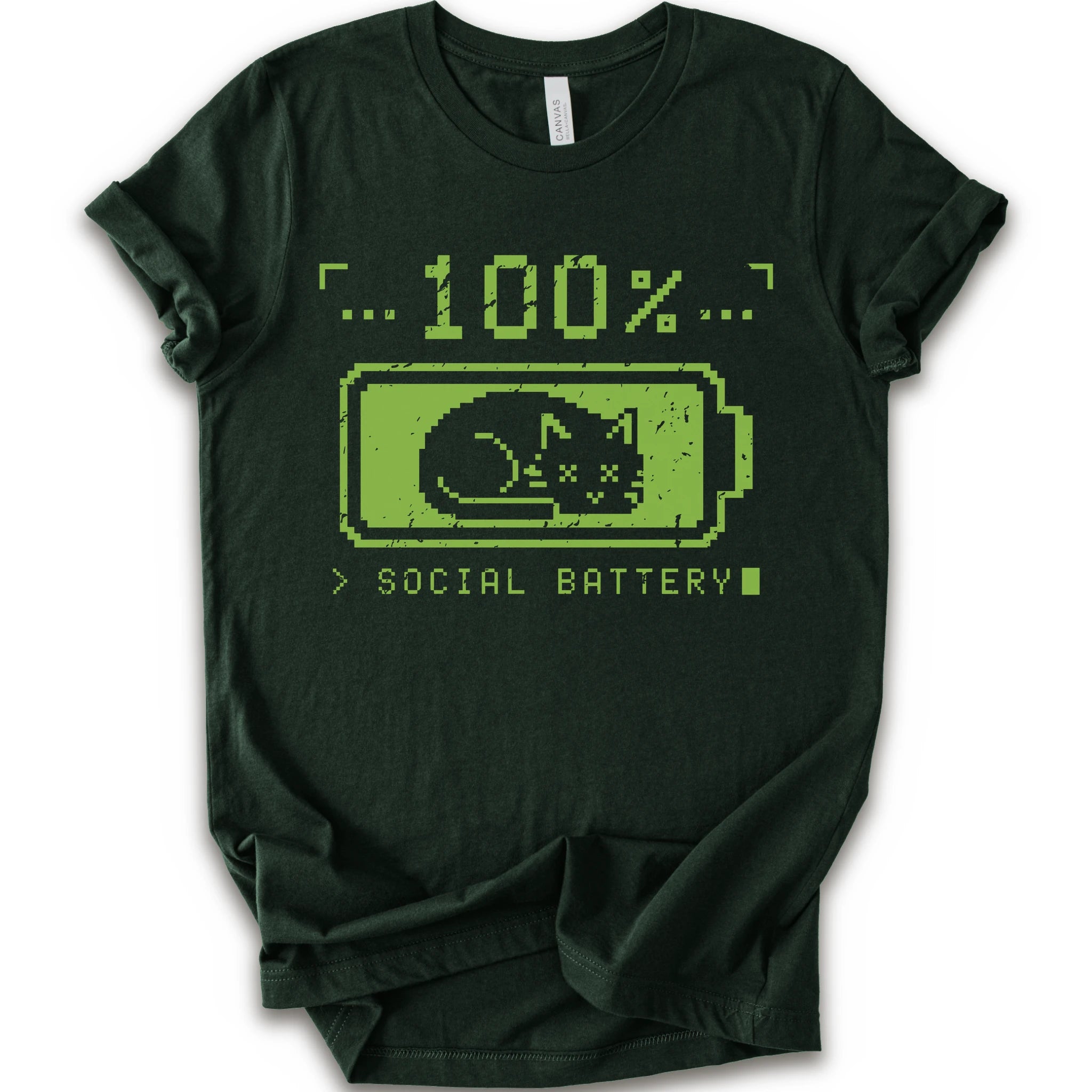 A forest t-shirt with a green pixel-art graphic of a sleeping cat inside a battery icon, with the text '100% SOCIAL BATTERY'.