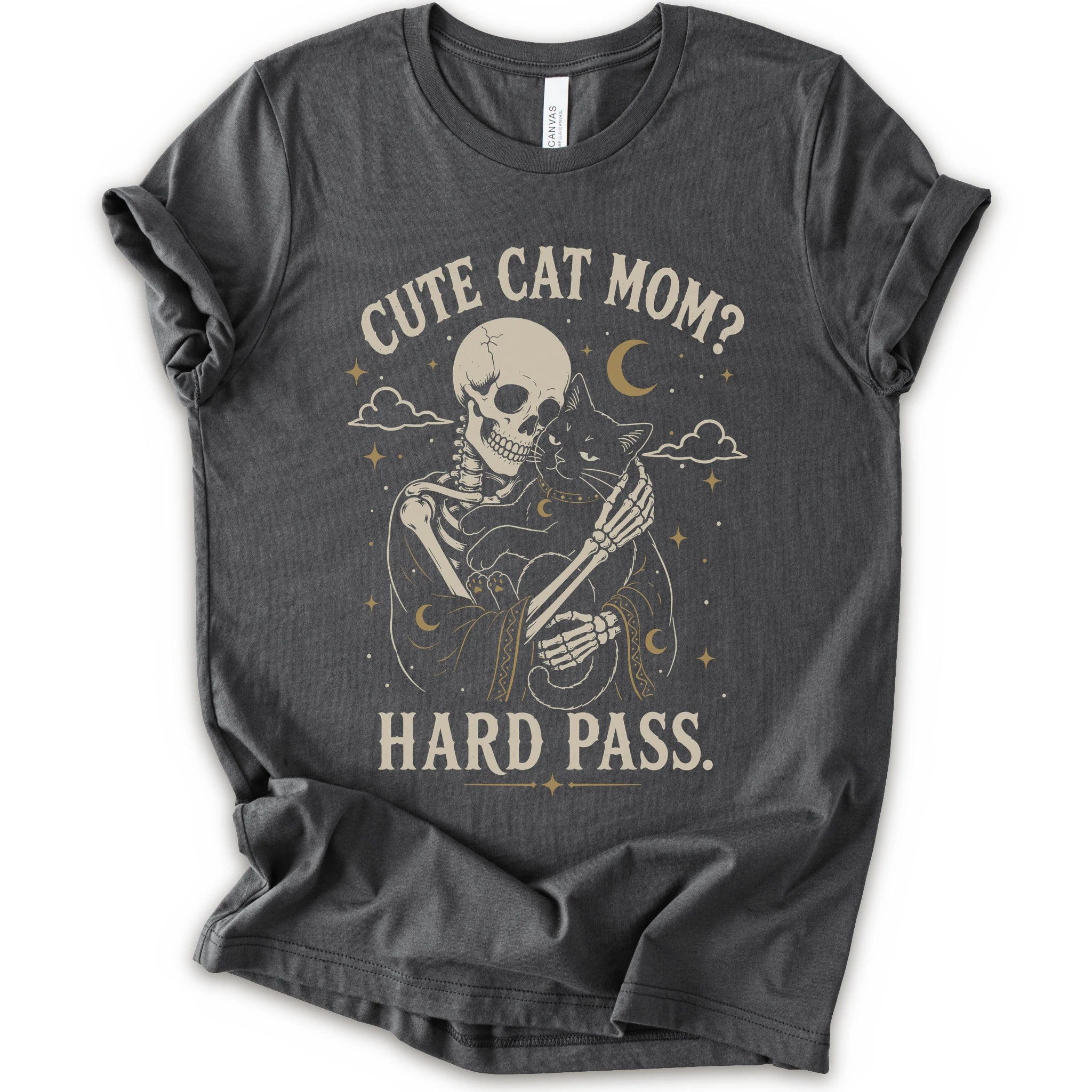 A asphalt short-sleeve crewneck t-shirt with a vintage-style graphic of a skeleton cat holding a black cat under the text 'CUTE CAT MOM? HARD PASS.' in a distressed cream color.