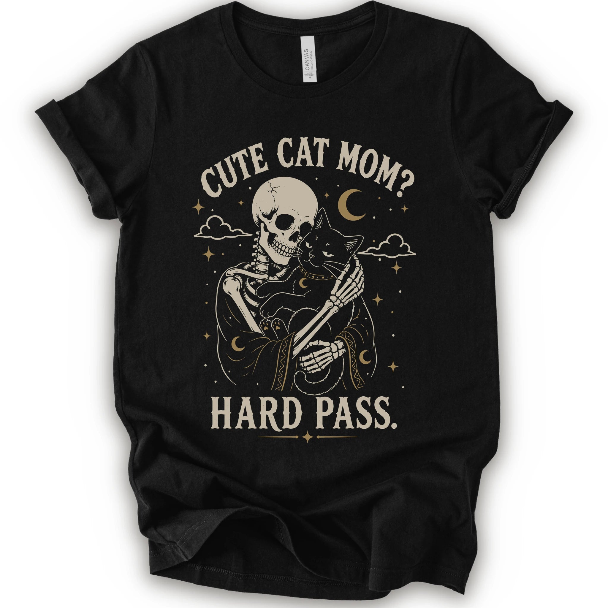 A black short-sleeve crewneck t-shirt with a vintage-style graphic of a skeleton cat holding a black cat under the text 'CUTE CAT MOM? HARD PASS.' in a distressed cream color.