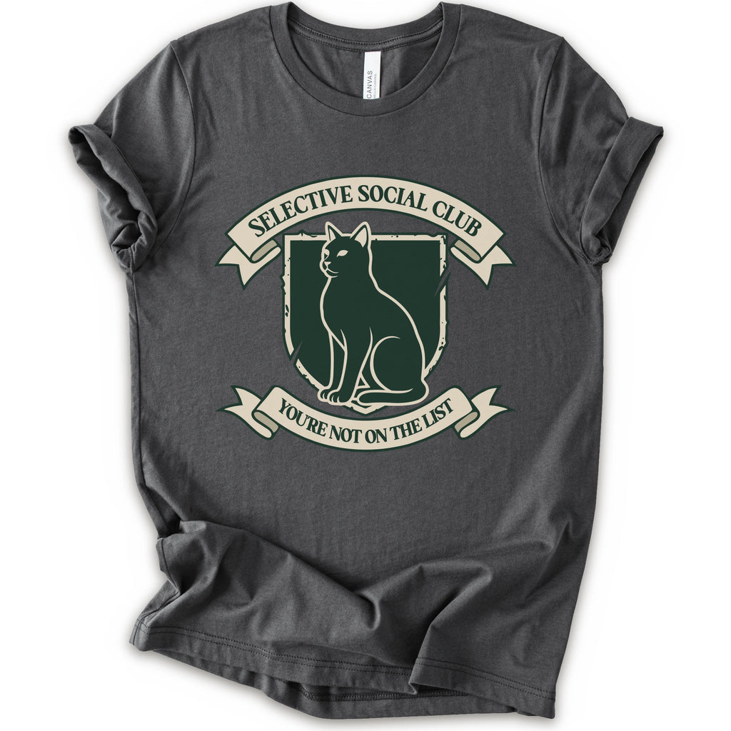 A asphalt short-sleeve crewneck t-shirt with a distressed graphic of a cat inside a crest, surrounded by banners reading 'SELECTIVE SOCIAL CLUB' and 'YOU'RE NOT ON THE LIST'.