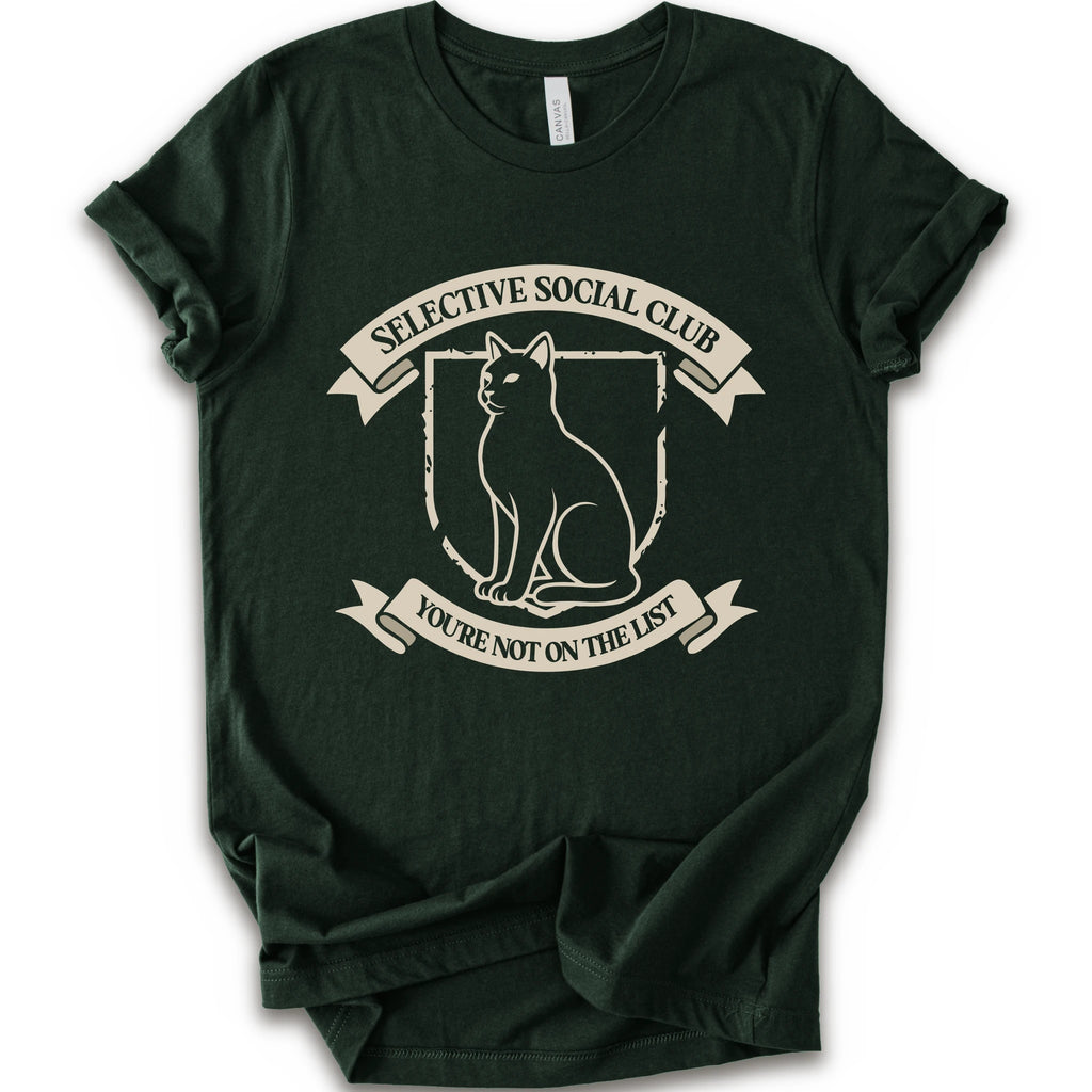A forest short-sleeve crewneck t-shirt with a distressed graphic of a cat inside a crest, surrounded by banners reading 'SELECTIVE SOCIAL CLUB' and 'YOU'RE NOT ON THE LIST'.