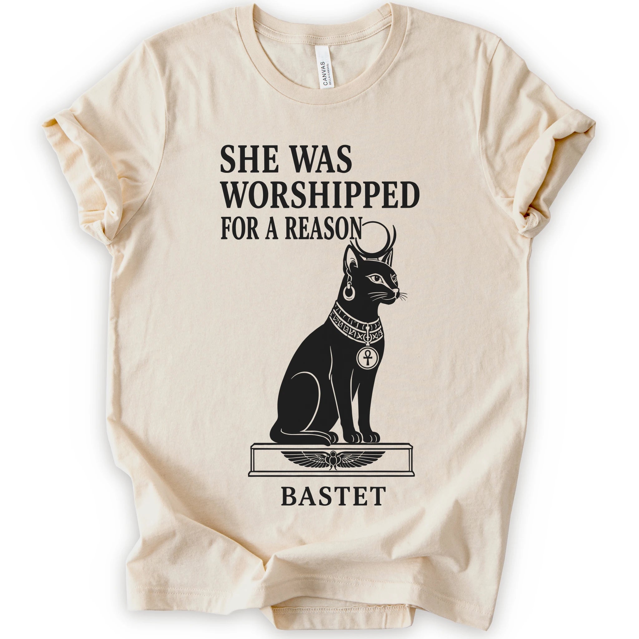 Natural Tee with Black Bastet cat with ankh pendant, Egyptian pedestal, and the text She Was Worshipped for a Reason