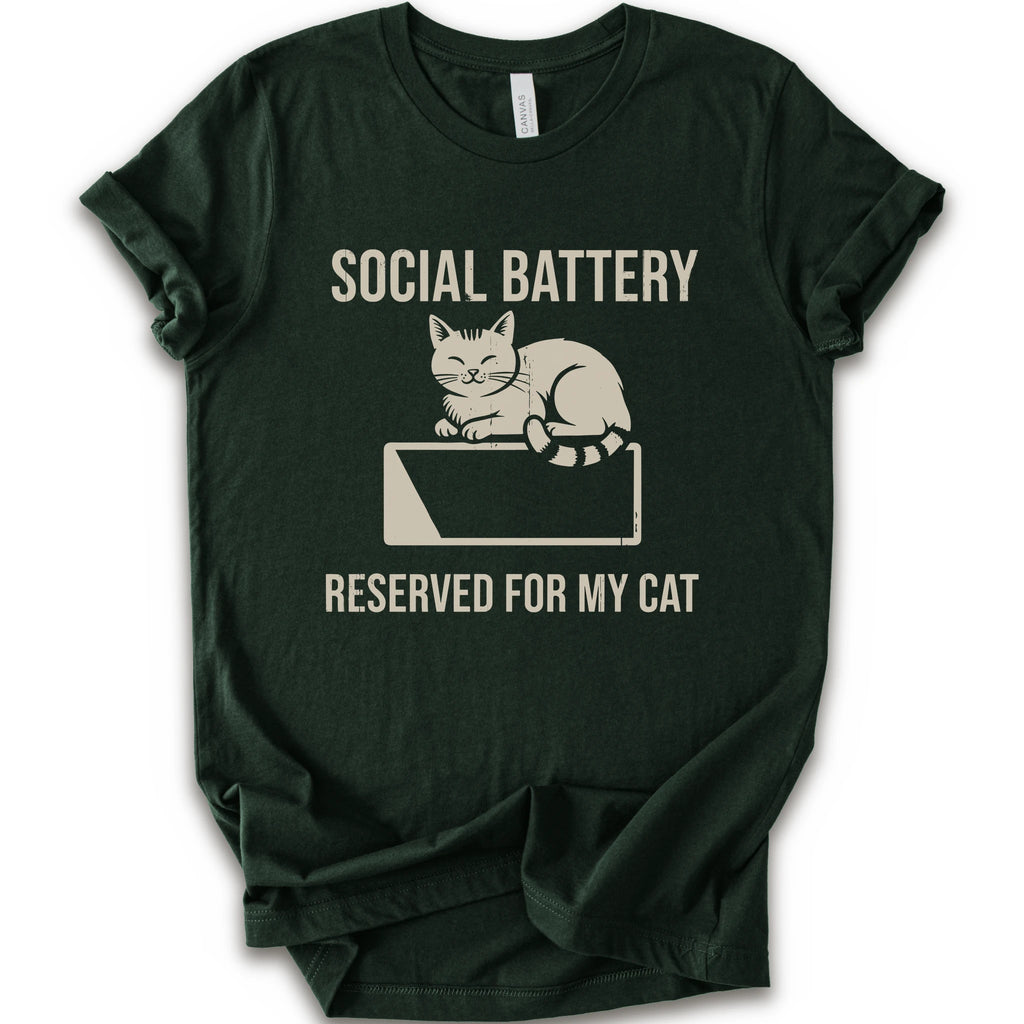 A forest short-sleeve crewneck T-shirt with a cat on a low battery graphic and “Social Battery Reserved for My Cat” text.