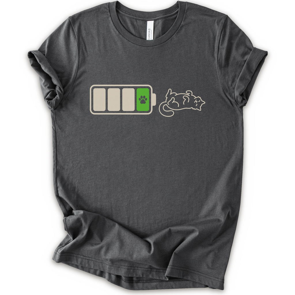 A asphalt short-sleeve crewneck t-shirt featuring a graphic of a battery with three bars, a green battery cell with a black paw print, and a white line-art illustration of a sleeping cat.