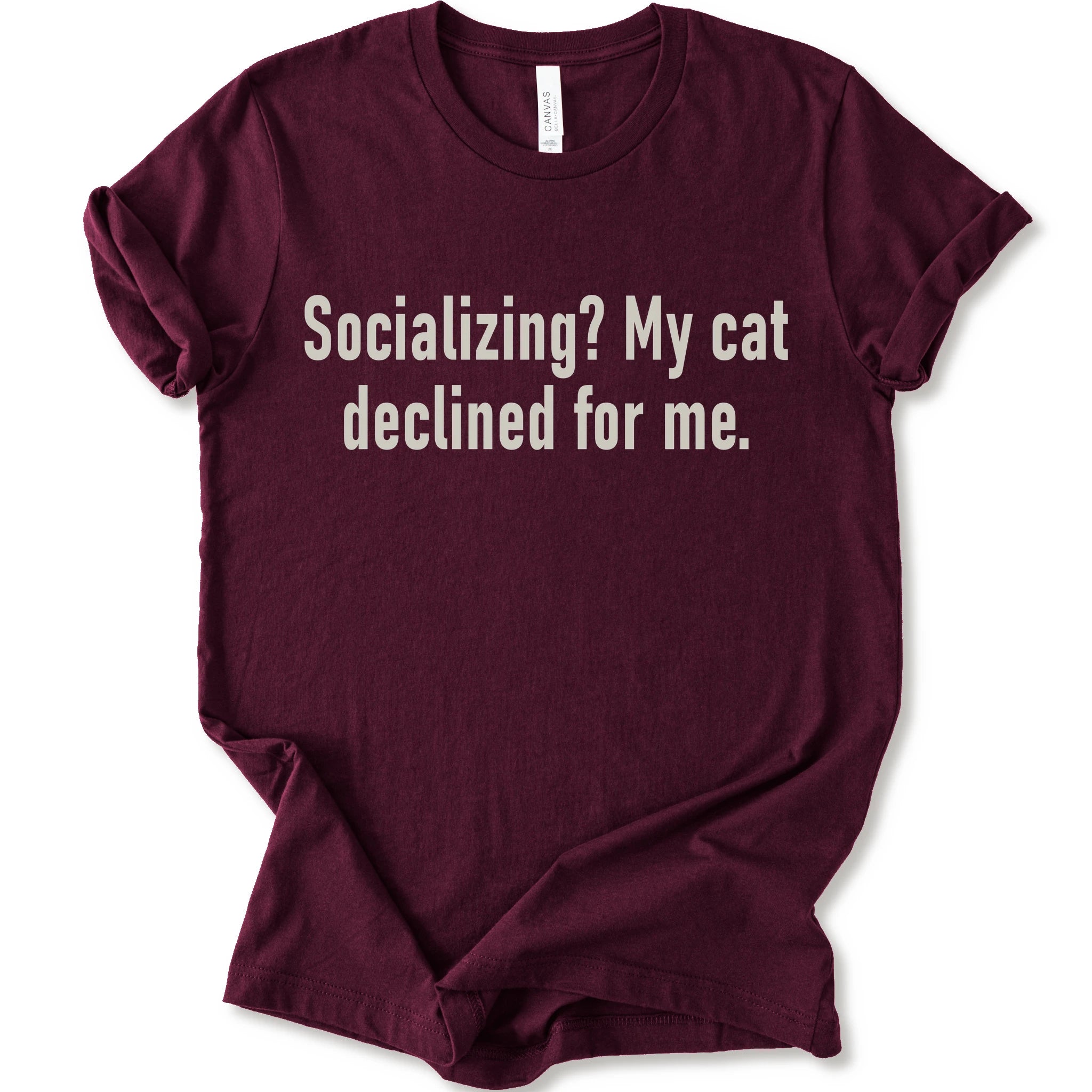 Maroon graphic t-shirt with text “Socializing? My cat declined for me.” in large cream text for an introvert cat T-shirt