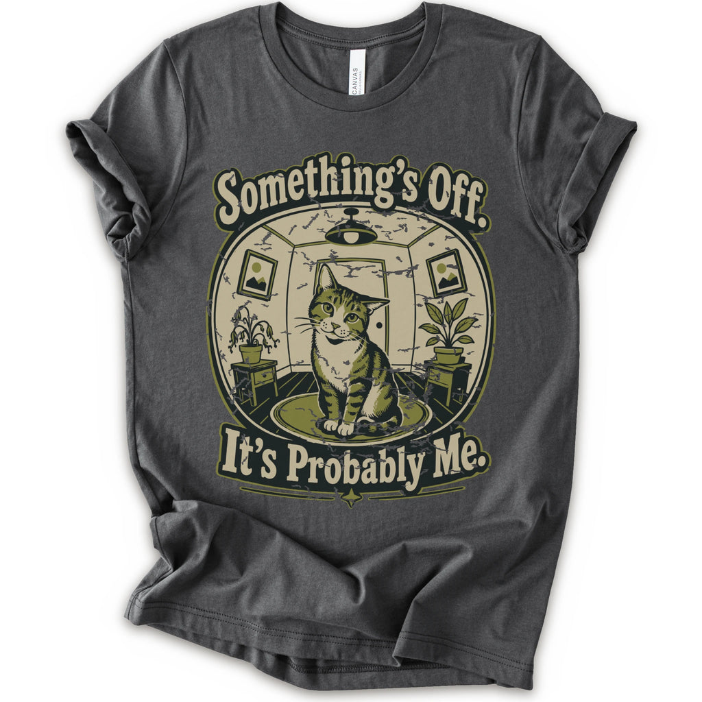 An asphalt short-sleeve crewneck t-shirt with a vintage-style graphic of a cat in a hat inside a circular room, with the text 'Something's Off. It's Probably Me.