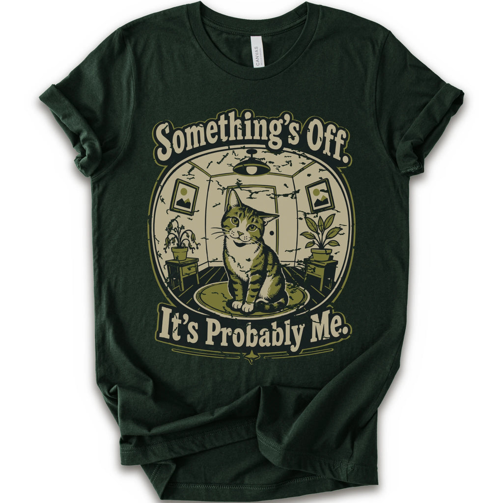 A forest short-sleeve crewneck t-shirt with a vintage-style graphic of a cat in a hat inside a circular room, with the text 'Something's Off. It's Probably Me.