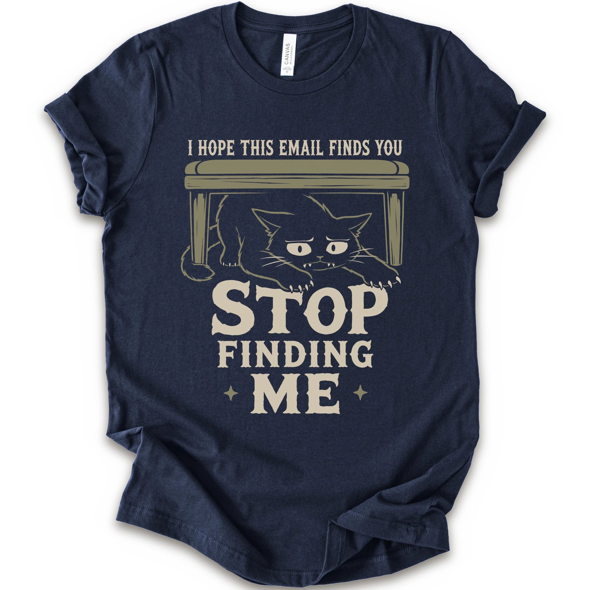 Navy graphic t-shirt  with a black cat crouching under a desk with “I Hope This Email Finds You” and “Stop Finding Me” distressed text