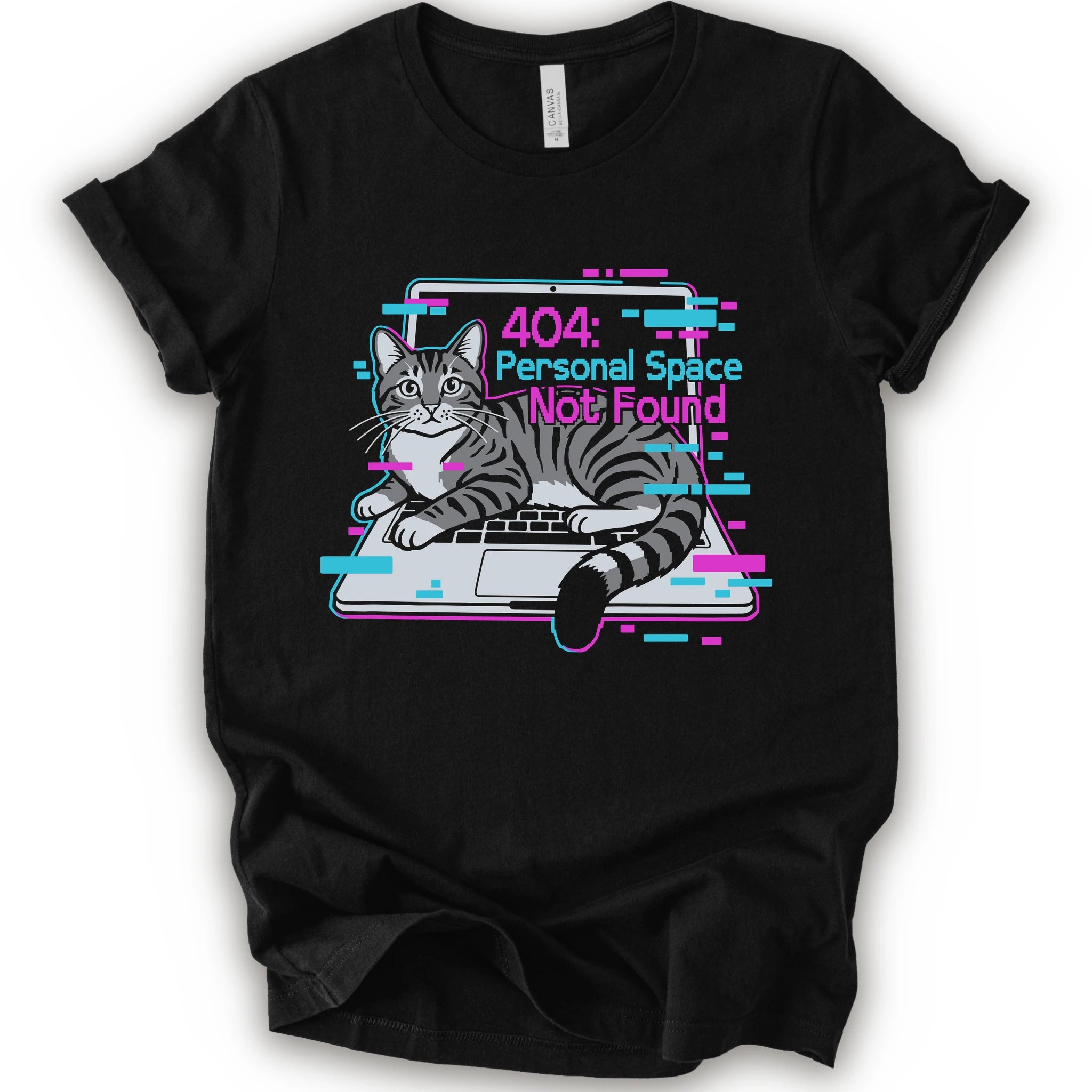 A black short-sleeve crewneck t-shirt with a graphic print of a gray tabby cat sitting in front of a laptop displaying a '404: Personal Space Not Found' error message in pink and cyan text.
