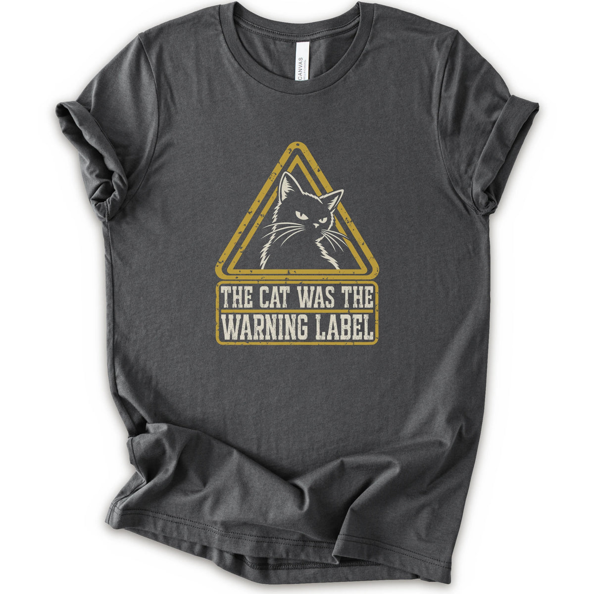 An asphalt short-sleeve crewneck t-shirt with a distressed yellow and white graphic on the front showing a cat inside a warning triangle and the text 'THE CAT WAS THE WARNING LABEL'.