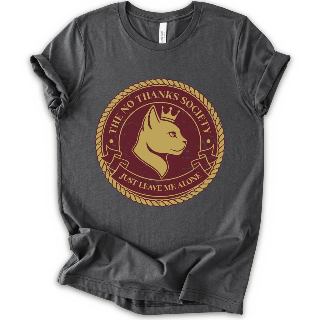 A asphalt short-sleeve t-shirt with a circular graphic print on the front. The graphic features a golden-yellow cat profile wearing a crown, surrounded by a rope border and the text 'THE NO THANKS SOCIETY' and 'JUST LEAVE ME ALONE' in a maroon background.