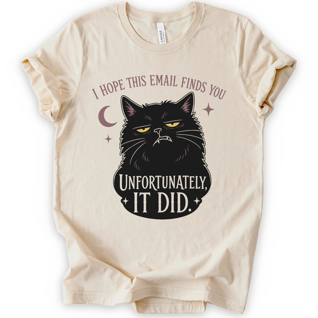 Natural graphic t-shirt with a black cat with yellow eyes beneath “I Hope This Email Finds You” and above “Unfortunately, It Did.”