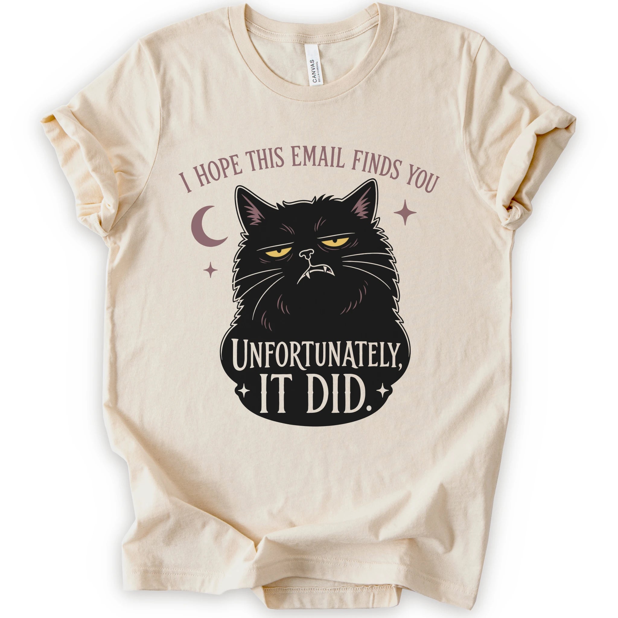 Natural graphic t-shirt with a black cat with yellow eyes beneath “I Hope This Email Finds You” and above “Unfortunately, It Did.”