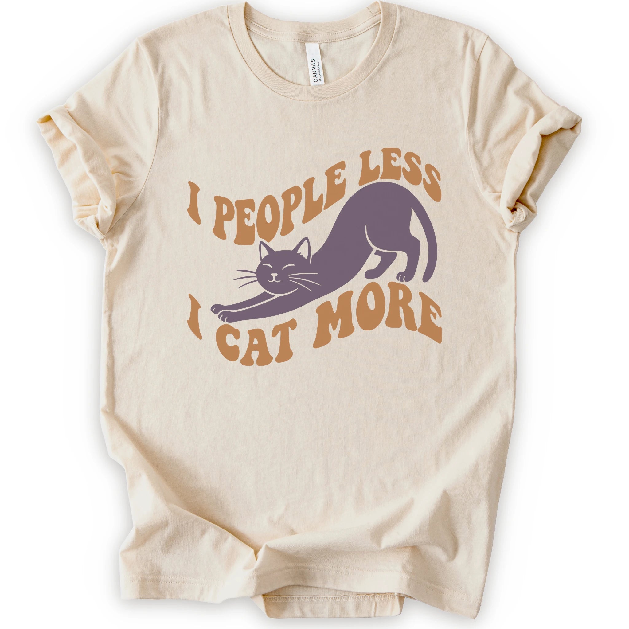 A natural short-sleeve crewneck t-shirt with a graphic of a stretching purple cat and the text 'I PEOPLE LESS I CAT MORE' in orange.