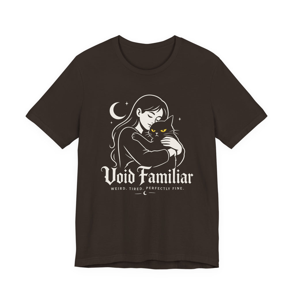 Brown Tee with Woman hugging a black cat beneath a crescent moon with “Void Familiar” and “Weird. Tired. Perfectly Fine.” text