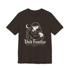 Brown Tee with Woman hugging a black cat beneath a crescent moon with “Void Familiar” and “Weird. Tired. Perfectly Fine.” text