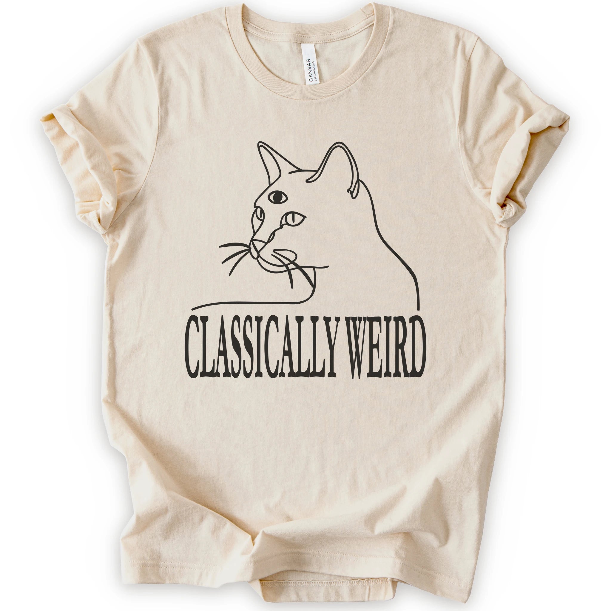 A natural short-sleeve crewneck t-shirt with a black-colored graphic of a cat's outline and the text 'CLASSICALLY WEIRD'.