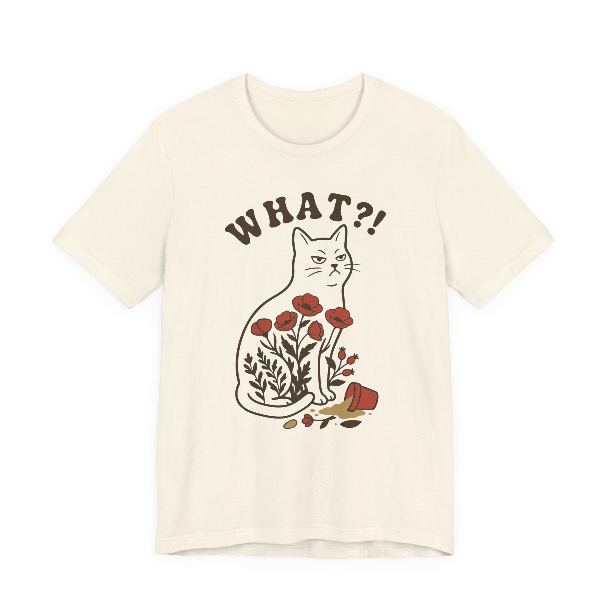 An natural short-sleeve t-shirt with a graphic of a brown cat sitting among red flowers, with the text 'WHAT?!' above it