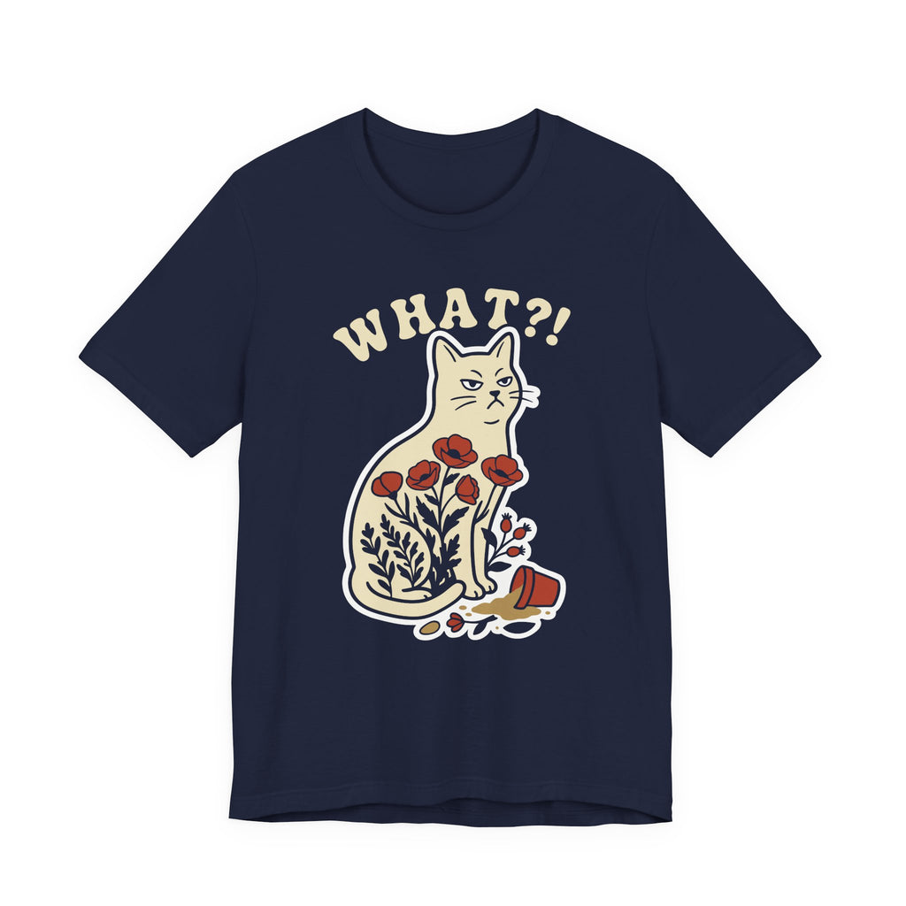 A navy short-sleeve t-shirt with a graphic of a white cat sitting among red flowers, with the text 'WHAT?!' above it