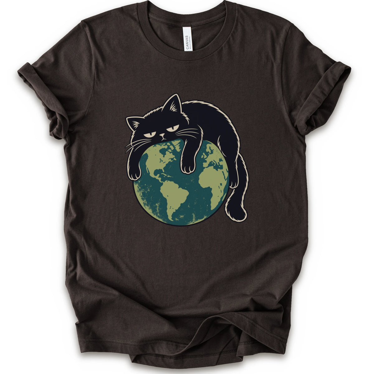 A brown short-sleeve crewneck t-shirt featuring a graphic of a grumpy black cat draped over a green and blue globe.