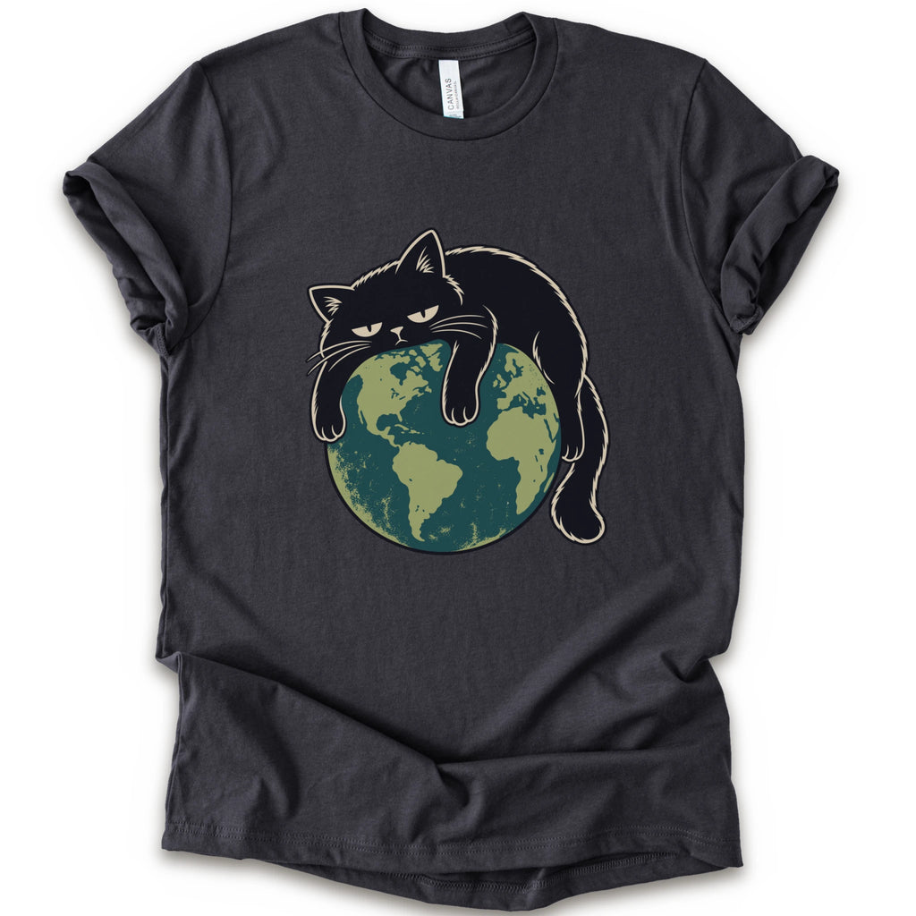 A dark grey short-sleeve crewneck t-shirt featuring a graphic of a grumpy black cat draped over a green and blue globe.