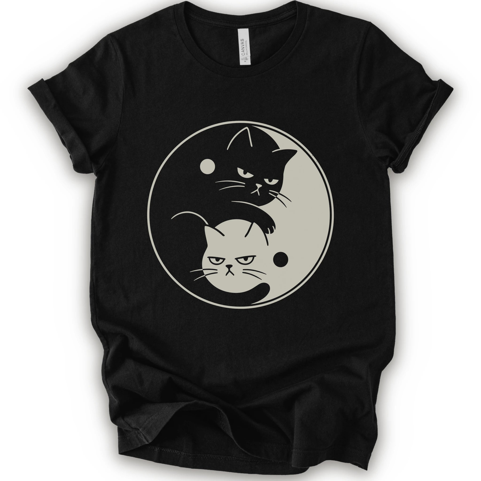 Black graphic t-shirt with two unimpressed cats, one black and one light, arranged in a yin-yang symbol