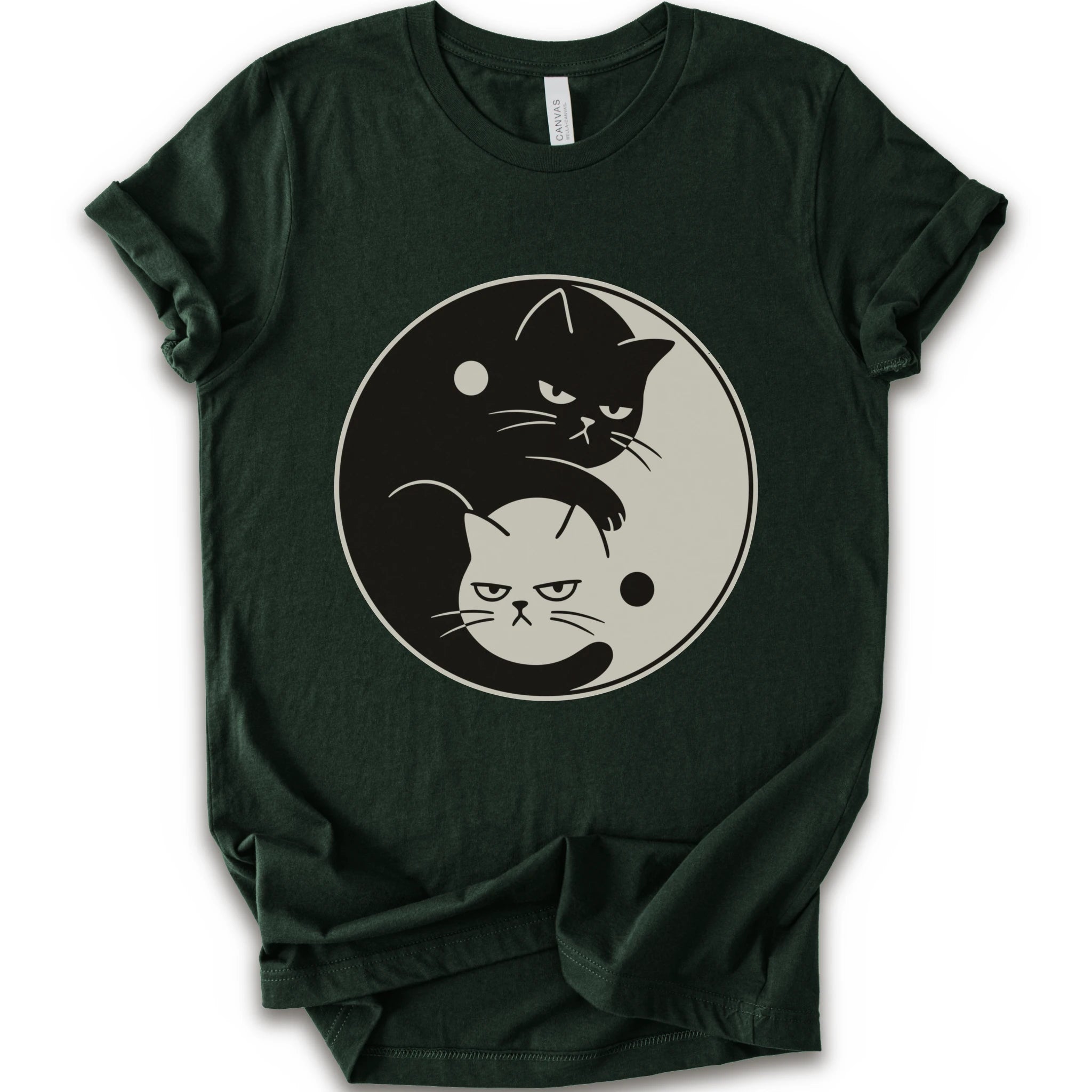 Forest graphic t-shirt with two unimpressed cats, one black and one light, arranged in a yin-yang symbol