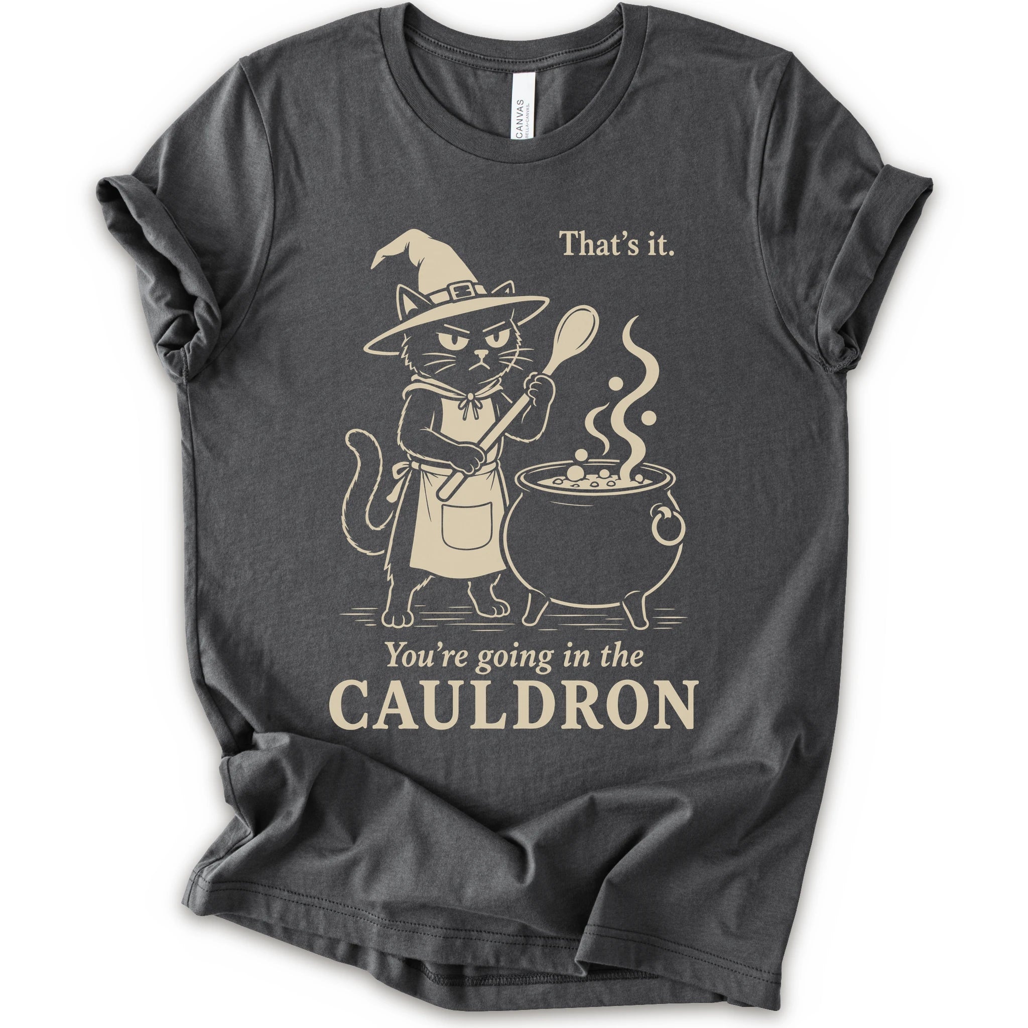 Asphalt graphic t-shirt with cat as a witch stirring a bubbling cauldron with “That’s it, you’re going in the cauldron” text