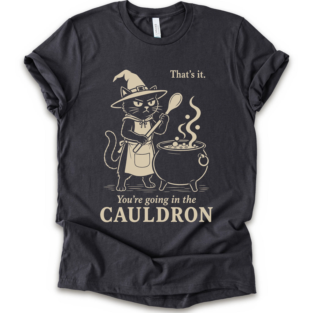 Dark Grey graphic t-shirt with cat as a witch stirring a bubbling cauldron with “That’s it, you’re going in the cauldron” text