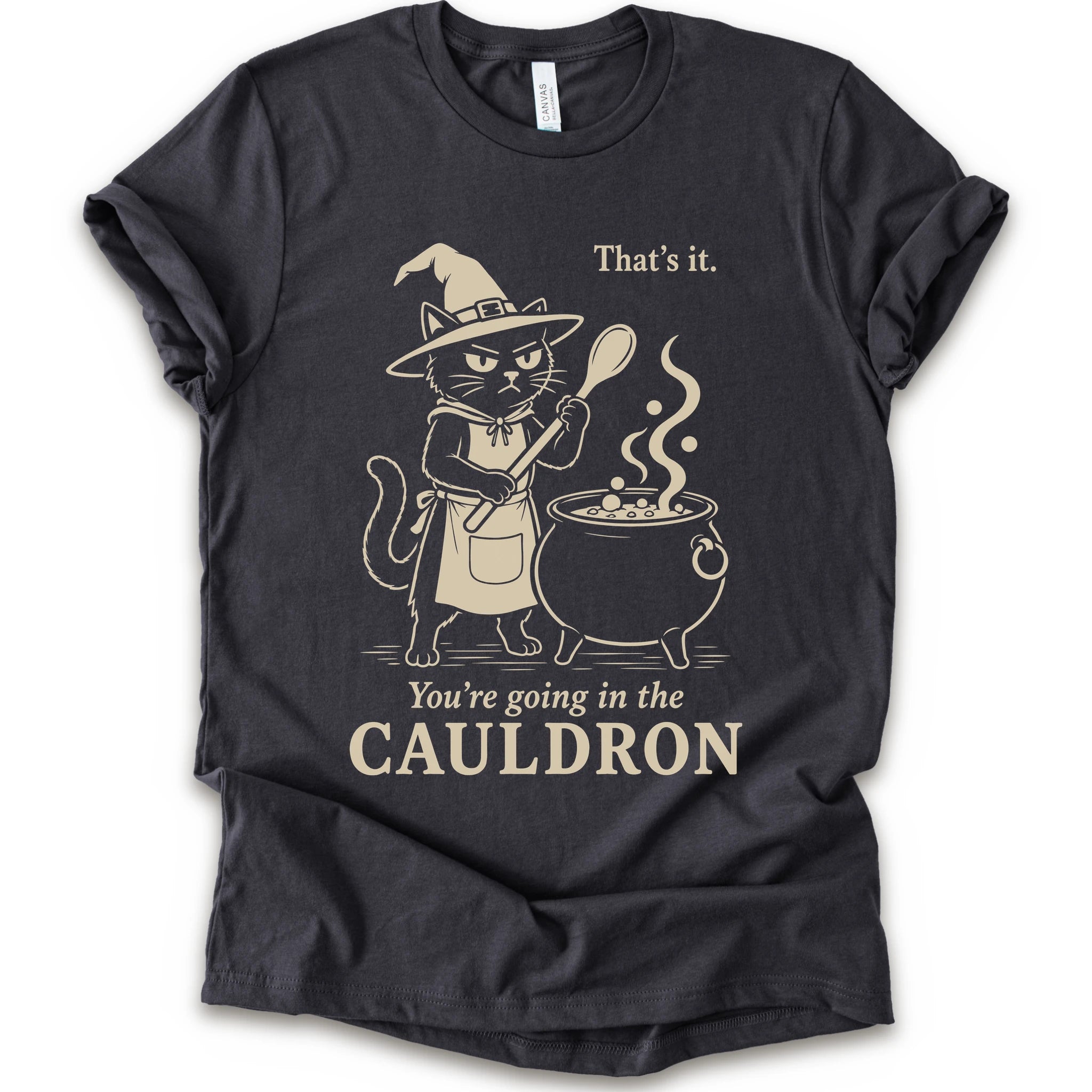 Dark Grey graphic t-shirt with cat as a witch stirring a bubbling cauldron with “That’s it, you’re going in the cauldron” text