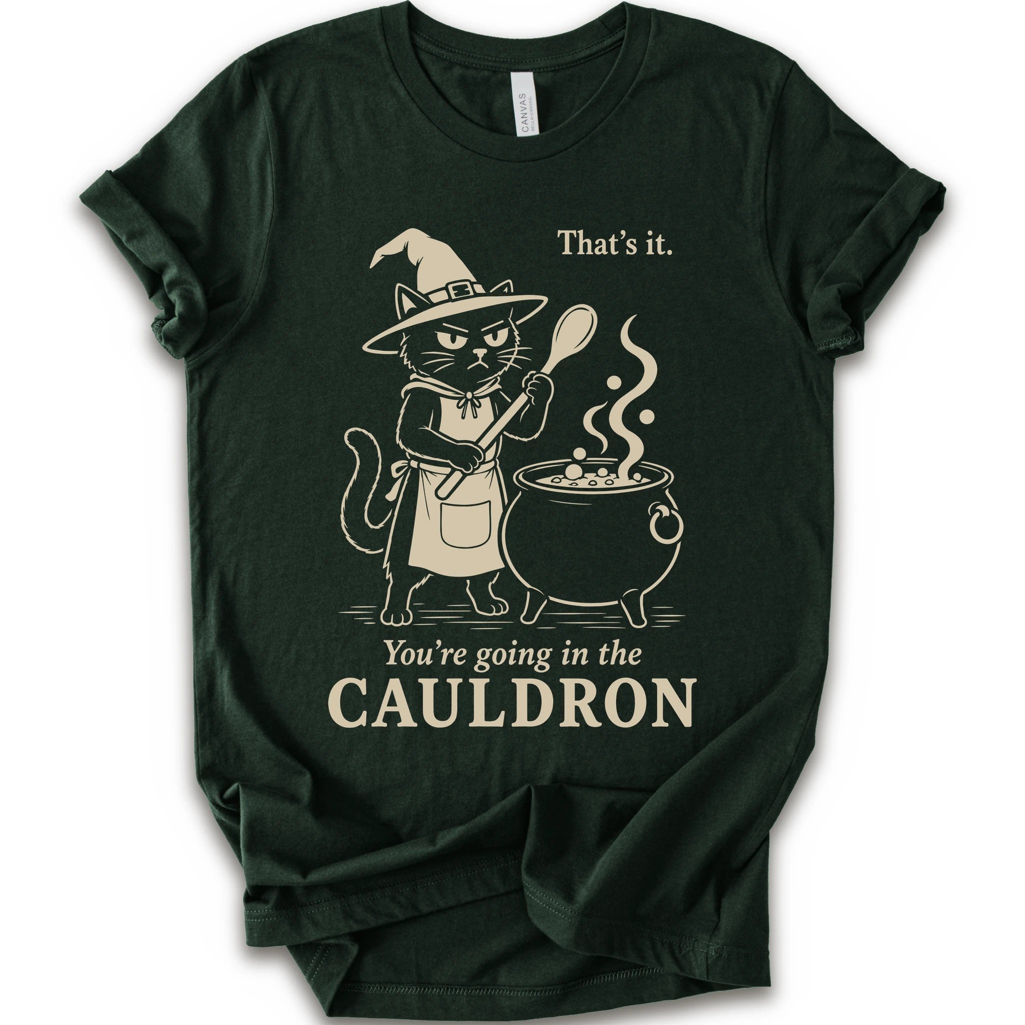 Forest graphic t-shirt with cat as a witch stirring a bubbling cauldron with “That’s it, you’re going in the cauldron” text