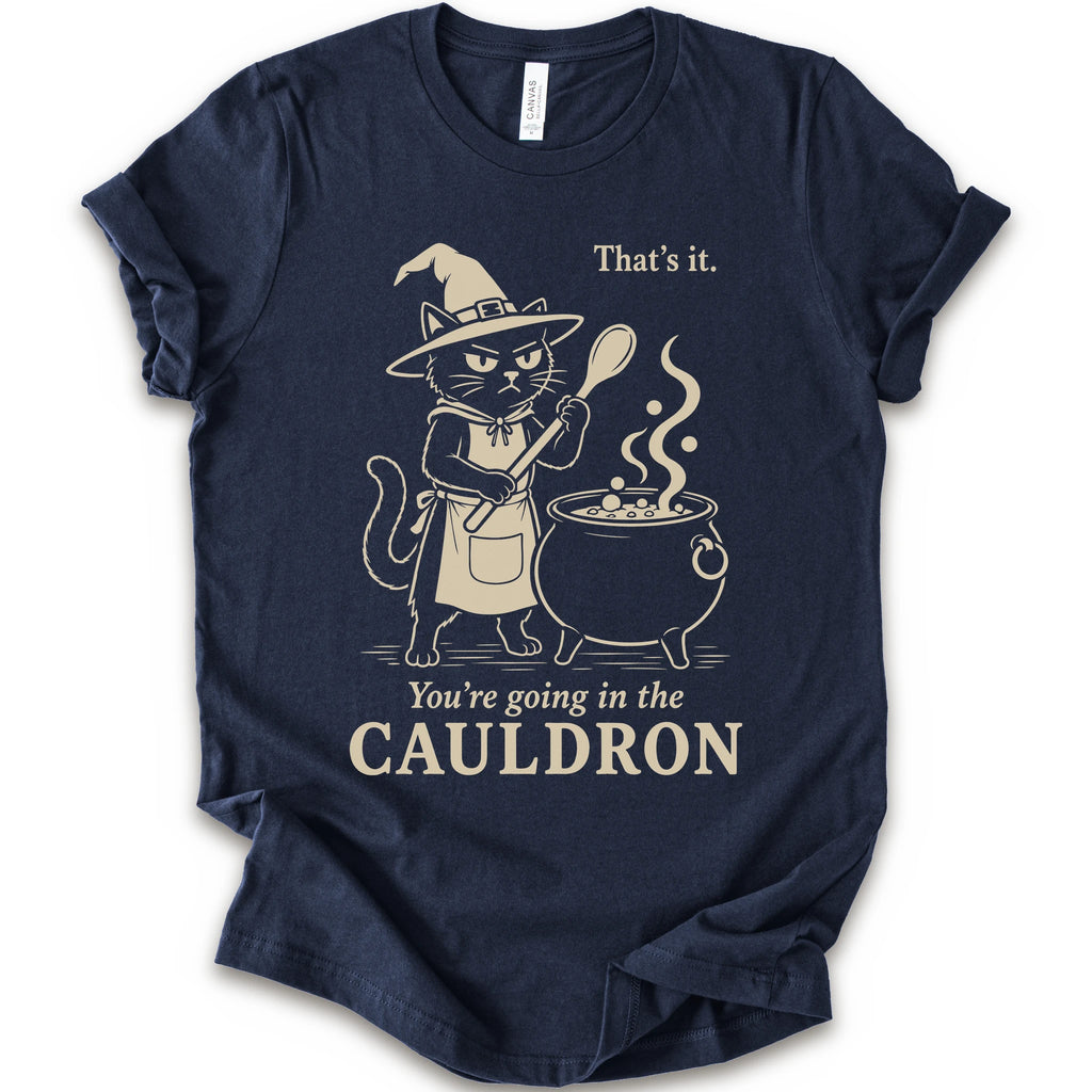 Navy graphic t-shirt with cat as a witch stirring a bubbling cauldron with “That’s it, you’re going in the cauldron” text